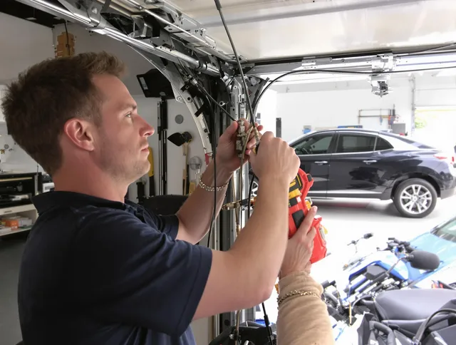 Fallbrook Garage Door Repair safety certified technician performing cable replacement in Fallbrook